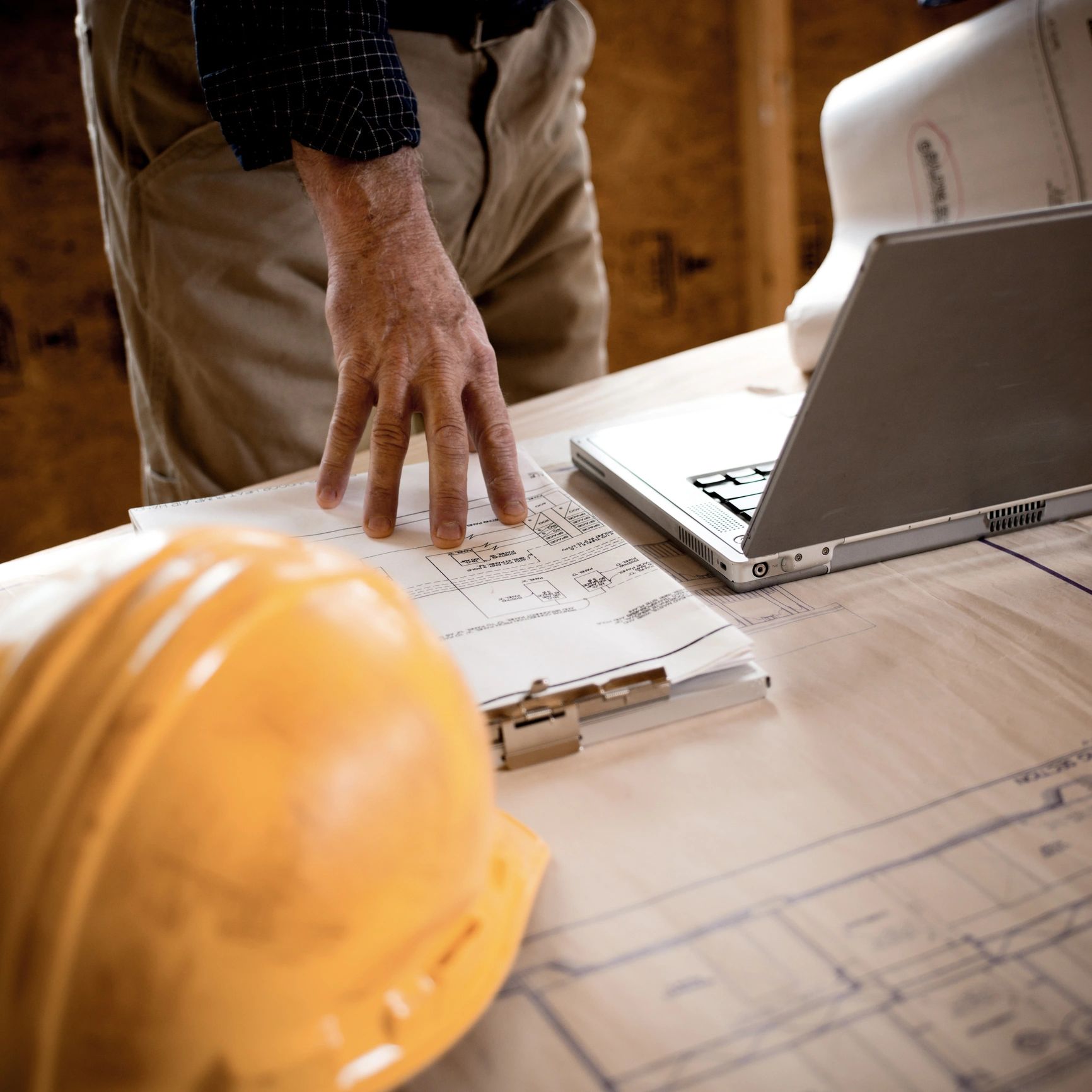 Project lead reviewing renovation plans