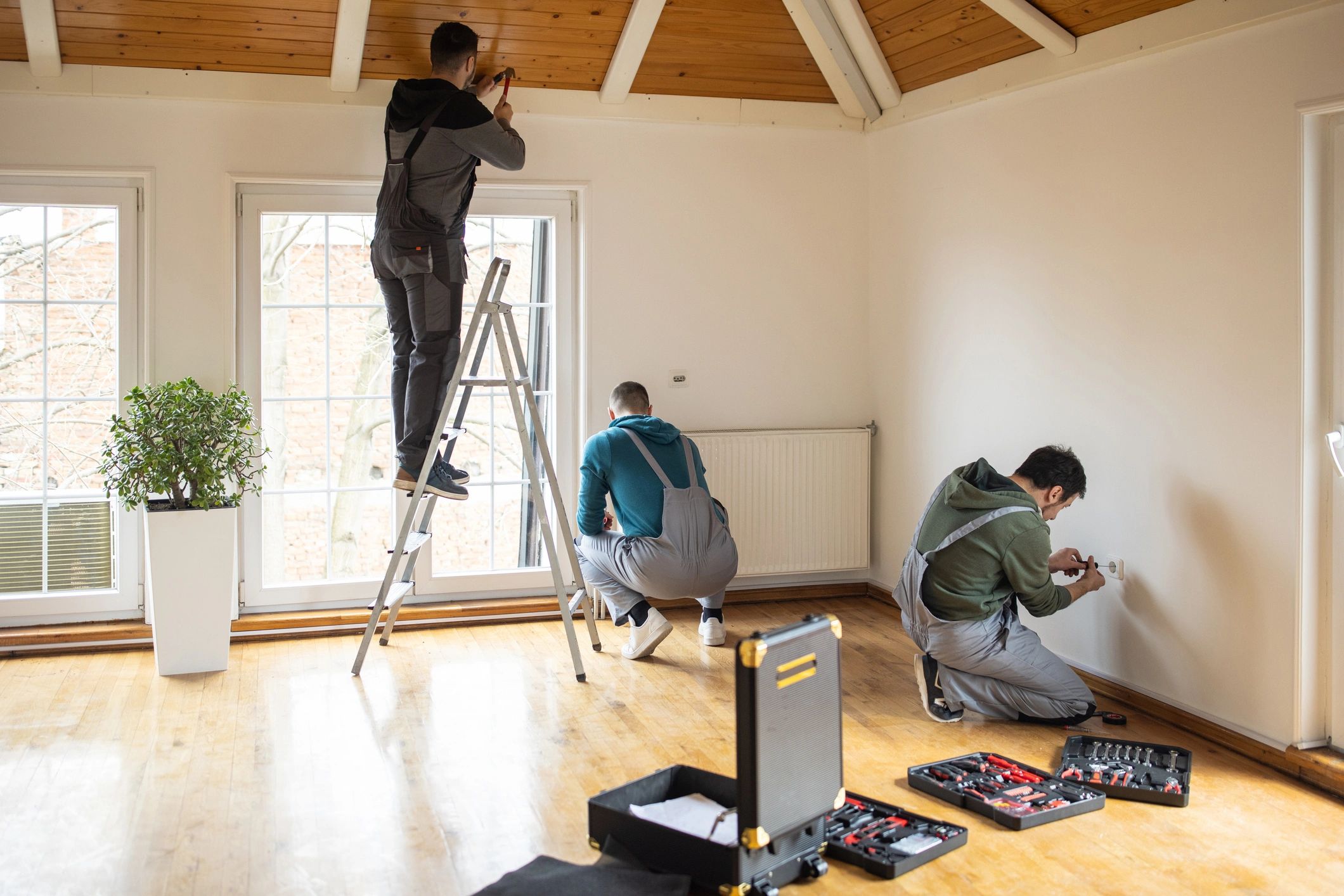 Home improvement professionals working inside a client's home