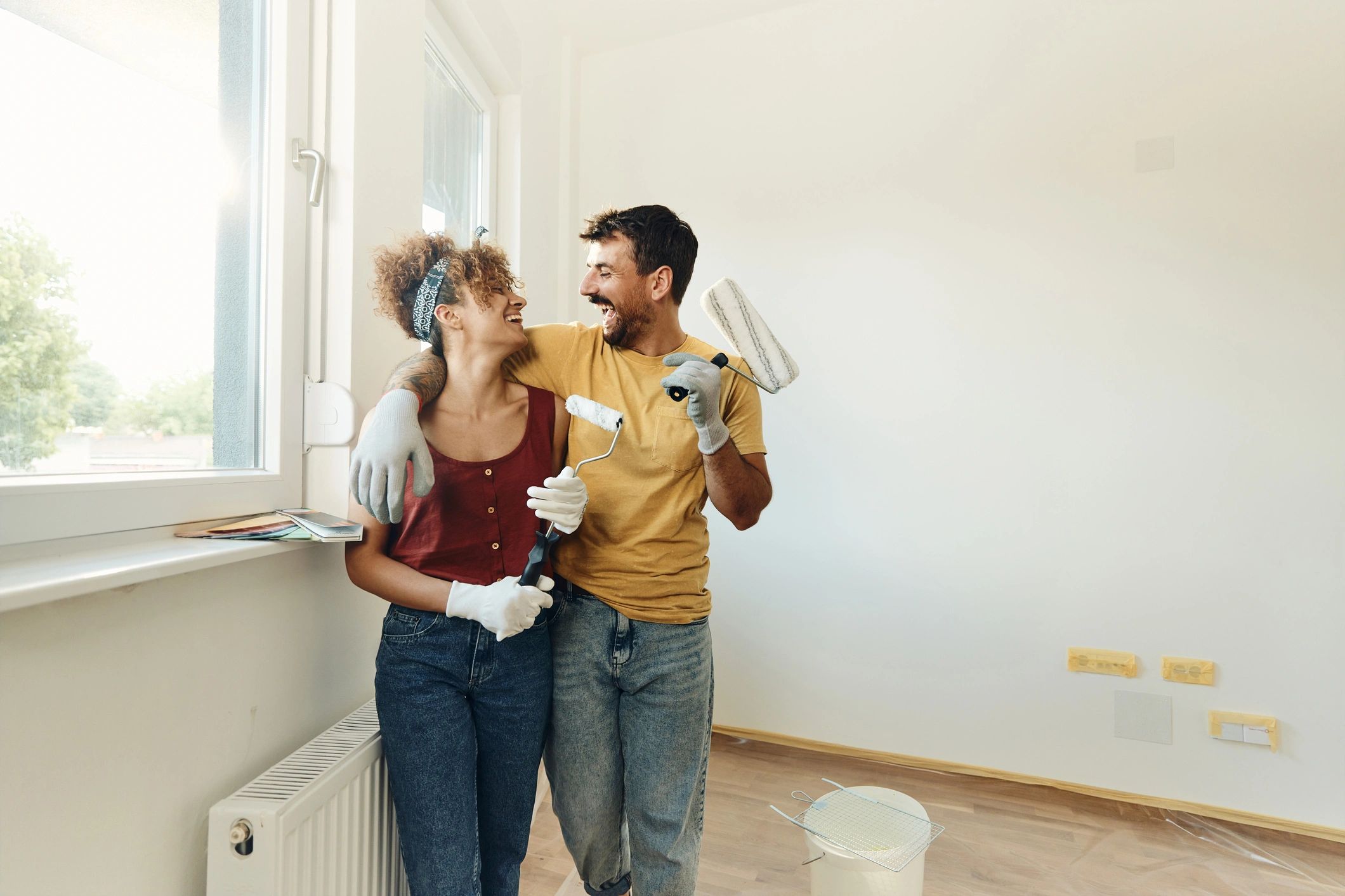 Homeowners discussing renovation plans during a home improvement project